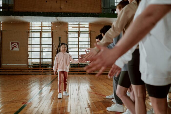 pexels-cottonbro-7337609 Supportive students in school gym
