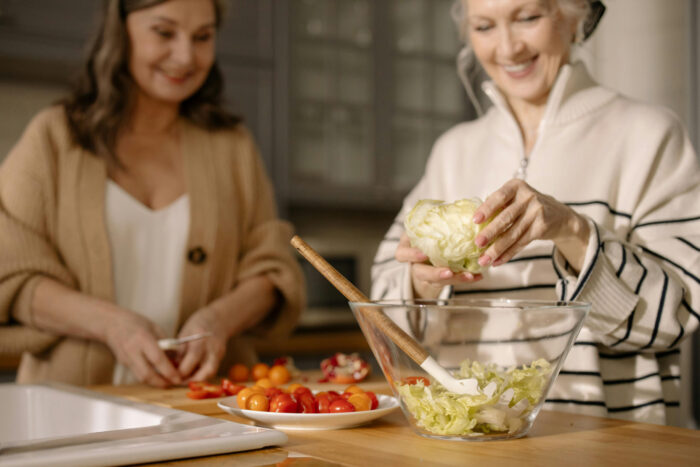 tml-women-kitchen women in kitchen preparing healthy food